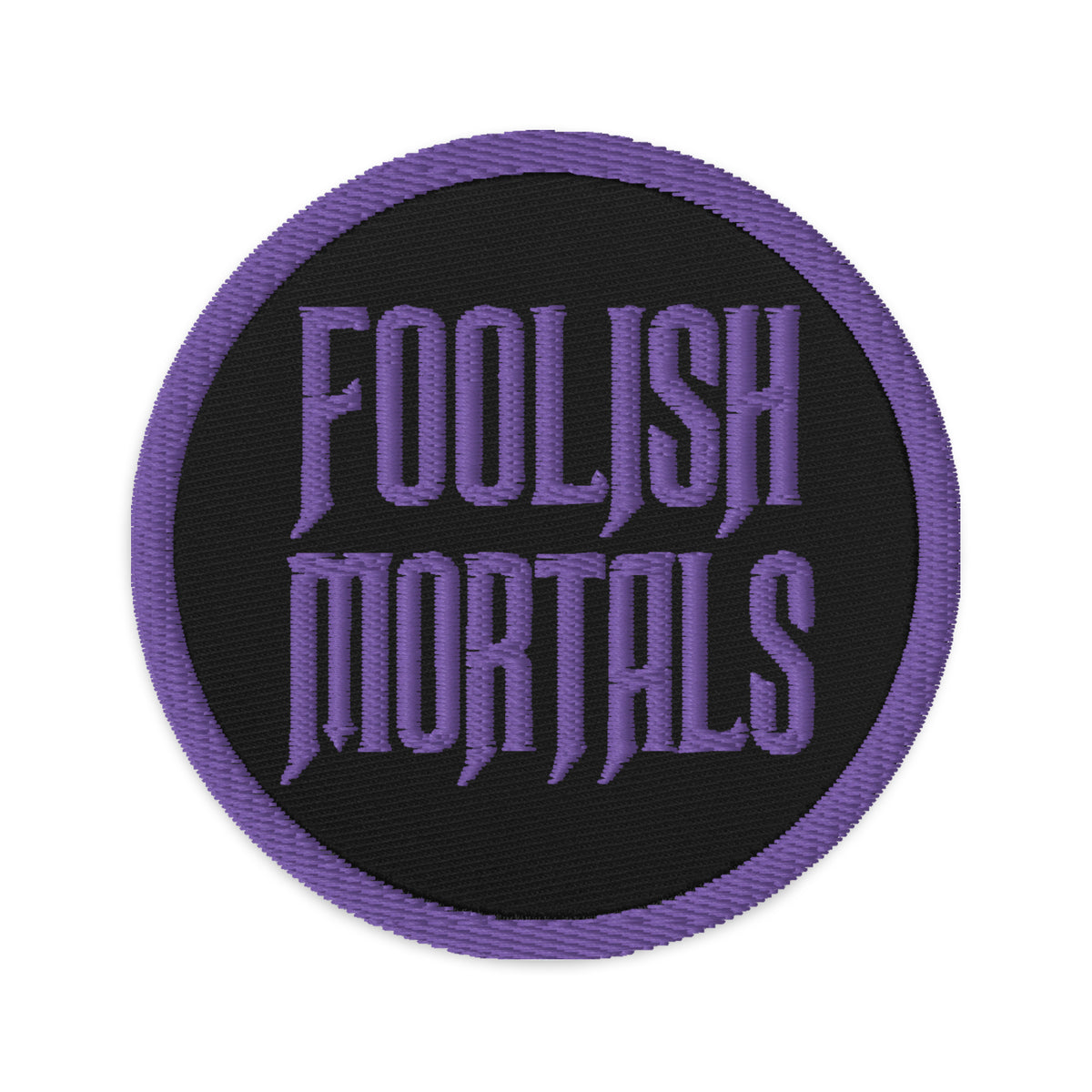 Circular embroidered patch featuring Purple Foolish Mortals Haunted Mansion, front view