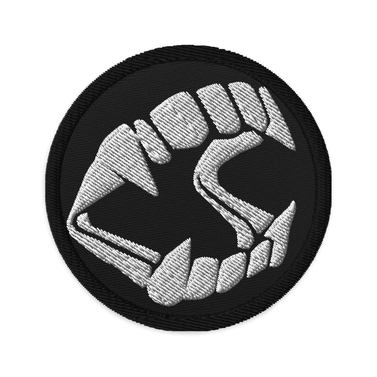 Circular embroidered patch featuring Vampire Fangs Novelty Halloween Toy Trick or Treat, front view
