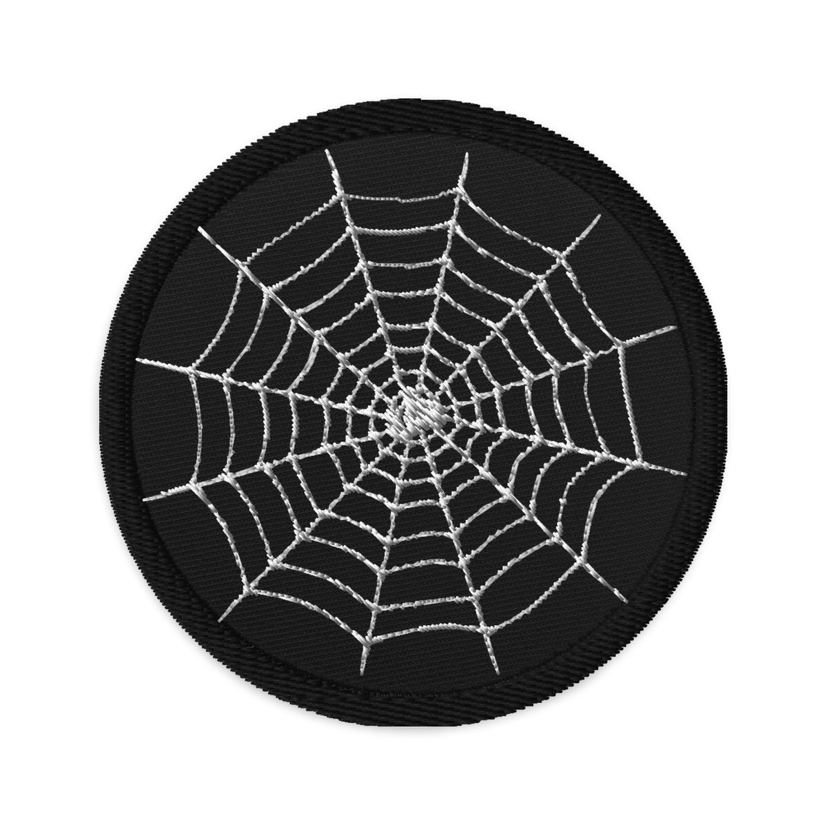 Circular embroidered patch featuring Creepy Spider's Web, front view