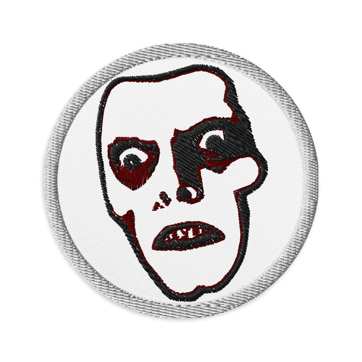 Circular embroidered patch featuring Horror Monster Pazuzu "Captain Howdy", front view