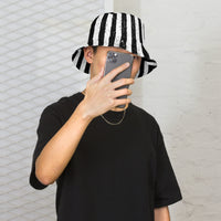 White bucket hat with Black and White Vertical Stripe Distressed embroidered artwork, front view