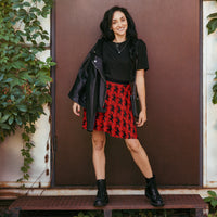Red Krampus pattern on women's skater skirt, front view