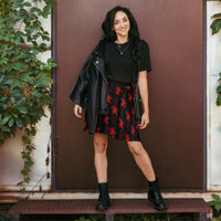 Black Krampus pattern on women's skater skirt, front view