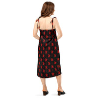 Black Krampus pattern on women's tie-strap slip dress, back view
