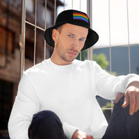 Black bucket hat with LGBTQ+ Pride embroidered artwork, front view