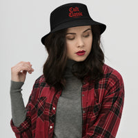 Black bucket hat with Cult Classic Red Gen X embroidered artwork, front view