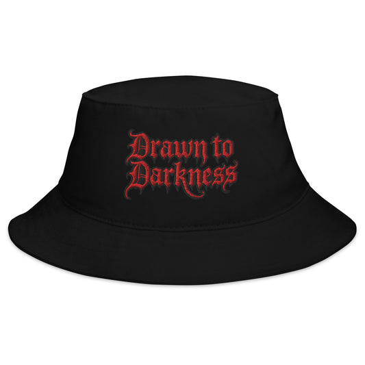 Black bucket hat with Drawn to Darkness Horror embroidered artwork, front view