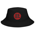 Black bucket hat with Madness Kanji 狂 (Kyō) embroidered artwork, front view