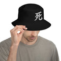 Black bucket hat with Japanese Kanji Death embroidered artwork, front view