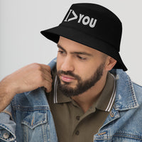 Black bucket hat with I Am Greater > Than You Sarcastic Meme embroidered artwork, left-front view