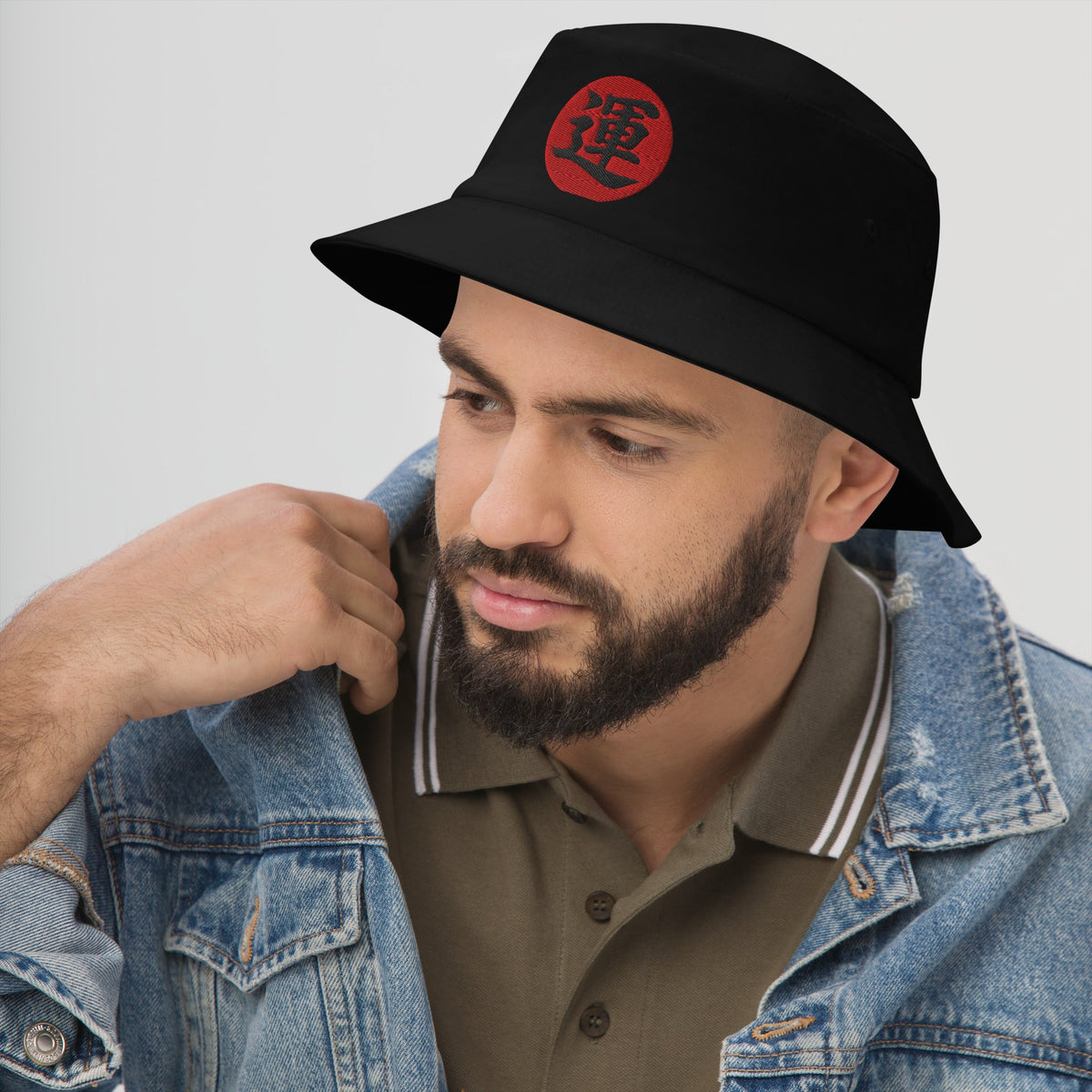 Black bucket hat with Luck Kanji 運 (Un) embroidered artwork, left-front view