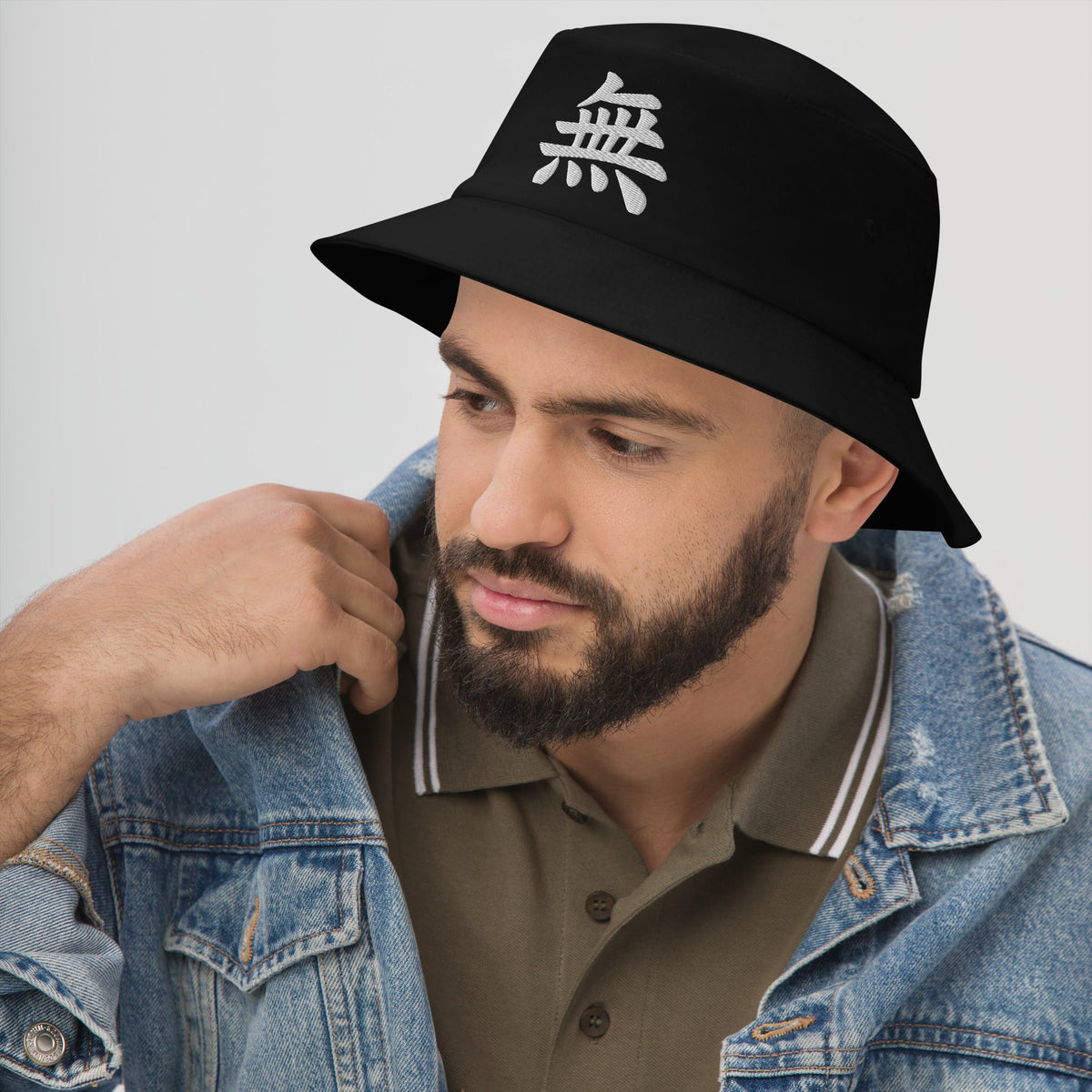 Black bucket hat with Japanese Kanji Void embroidered artwork, left-front view