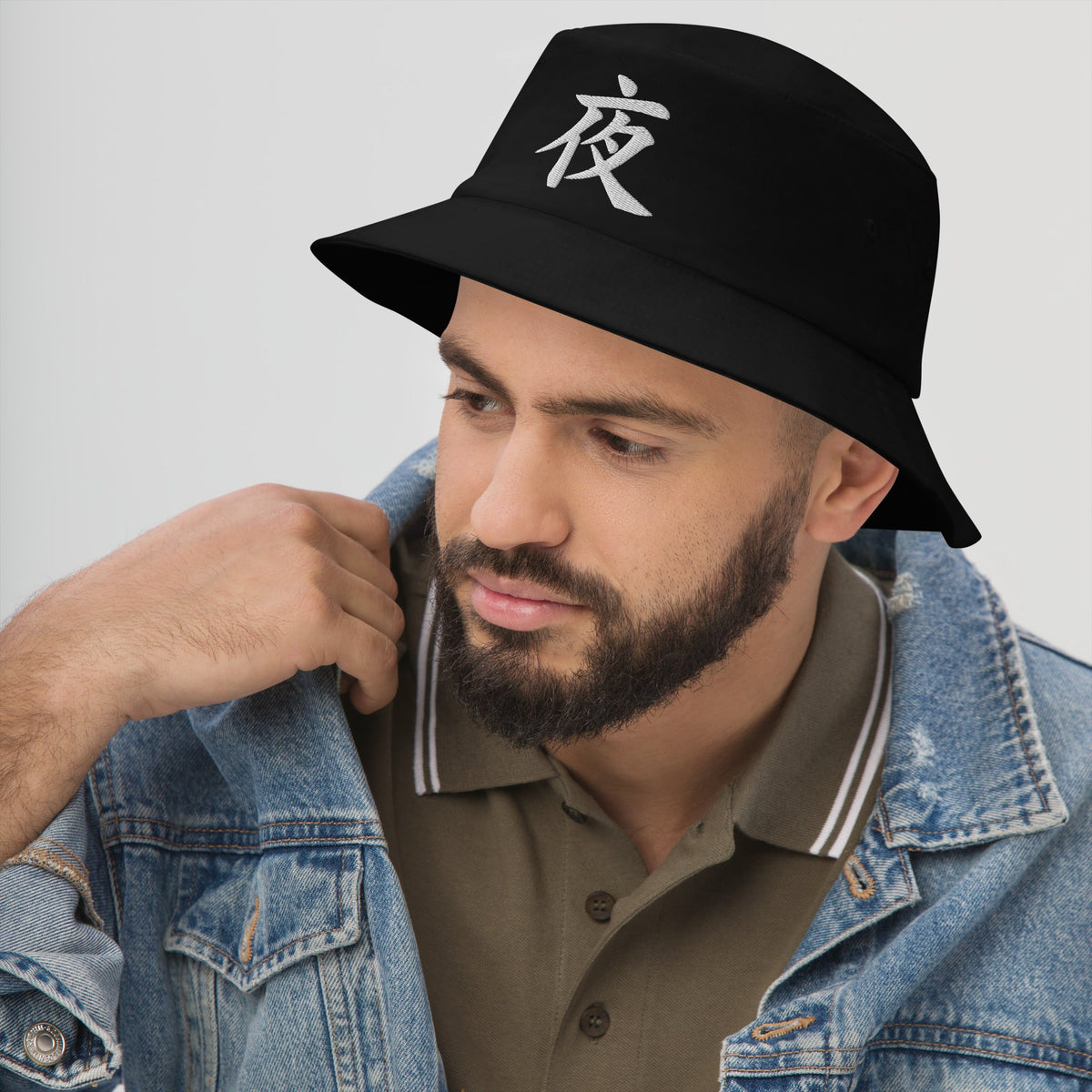 Black bucket hat with Japanese Kanji Night embroidered artwork, left-front view