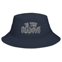 Navy bucket hat with In The Shadows Horror embroidered artwork, front view