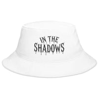 White bucket hat with In The Shadows Horror embroidered artwork, front view