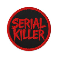 Circular embroidered patch featuring Red Serial Killer True Crime, front view