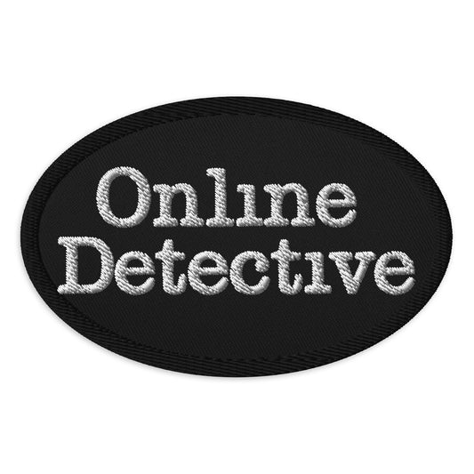 Oval embroidered patch featuring Online Detective, front view