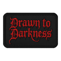 Rectangle embroidered patch featuring Drawn to Darkness Iron On, front view