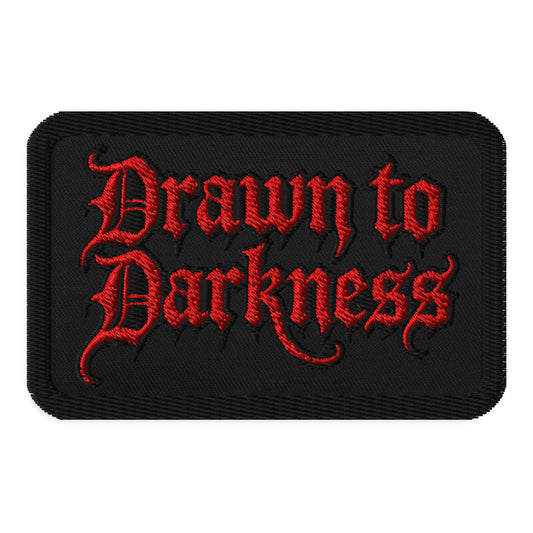 Rectangle embroidered patch featuring Drawn to Darkness Iron On, front view