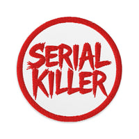 Circular embroidered patch featuring Red Serial Killer True Crime, front view