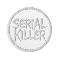Circular embroidered patch featuring White Serial Killer True Crime, front view