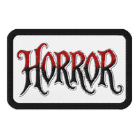 Rectangle embroidered patch featuring HORROR Iron On, front view