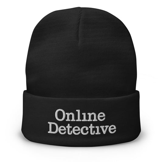 Black cuffed beanie with Online Detective embroidered artwork, front view