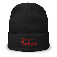 Black cuffed beanie with Drawn to Darkness Horror embroidered artwork, front view