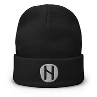 Black cuffed beanie with Hagalaz Rune embroidered artwork, front view