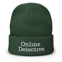 Green cuffed beanie with Online Detective embroidered artwork, front view