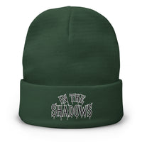 Green cuffed beanie with In The Shadows Horror embroidered artwork, front view
