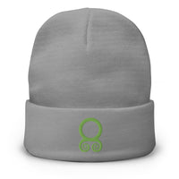 Gray cuffed beanie with Green Viking Troll Cross embroidered artwork, front view