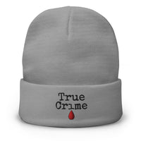 Gray cuffed beanie with True Crime Blood Drop embroidered artwork, front view