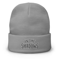 Gray cuffed beanie with In The Shadows Horror embroidered artwork, front view