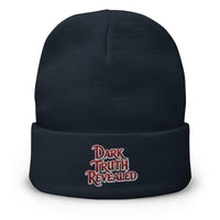 Navy cuffed beanie with Dark Truth Revealed True Crime embroidered artwork, front view