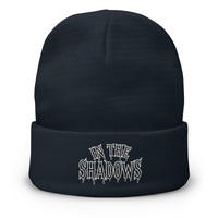 Navy cuffed beanie with In The Shadows Horror embroidered artwork, front view