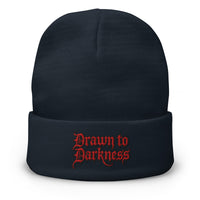 Navy cuffed beanie with Drawn to Darkness Horror embroidered artwork, front view