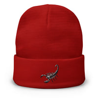 Red cuffed beanie with Scorpion Sting embroidered artwork, front view