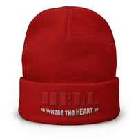 Red cuffed beanie with Hell Is Where The Heart Is embroidered artwork, front view