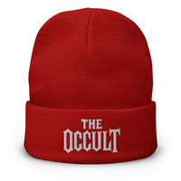 Red cuffed beanie with The Occult White Supernatural embroidered artwork, front view