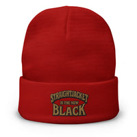 Red cuffed beanie with Straightjacket Is the New Black embroidered artwork, front view