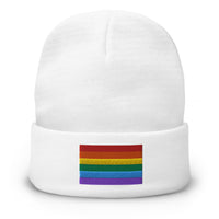 White cuffed beanie with LGBTQ+ Pride Rainbow embroidered artwork, front view