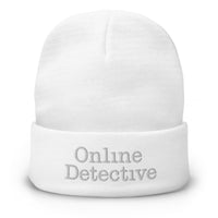 White cuffed beanie with Online Detective embroidered artwork, front view