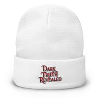 White cuffed beanie with Dark Truth Revealed True Crime embroidered artwork, front view