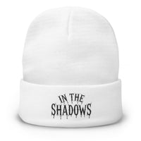 White cuffed beanie with In The Shadows Horror embroidered artwork, front view