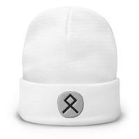 White cuffed beanie with Othala Rune embroidered artwork, front view