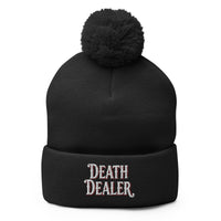 Black pom-pom beanie with Death Dealer True Crime embroidered artwork, front view