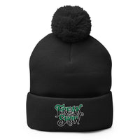 Black pom-pom beanie with Freak Show embroidered artwork, front view