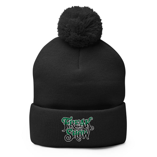 Black pom-pom beanie with Freak Show embroidered artwork, front view