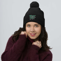 Black pom-pom beanie with Freak Show embroidered artwork, front view